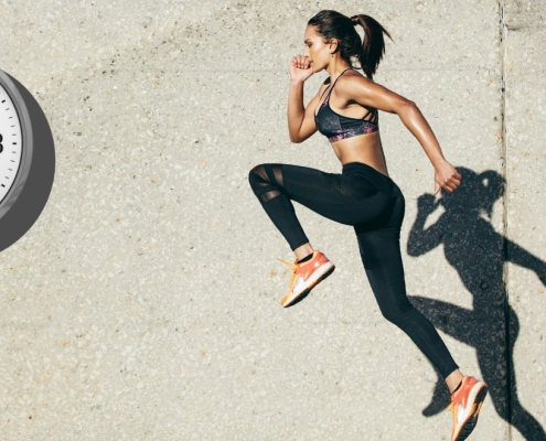 Woman and her shadow jumping infront of a wall clock
