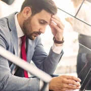 the-real-cbd-blog-CBD-for-Social-Exhaustion-and-Burnout-Symptoms Man sitting on a starircase looking exhausted