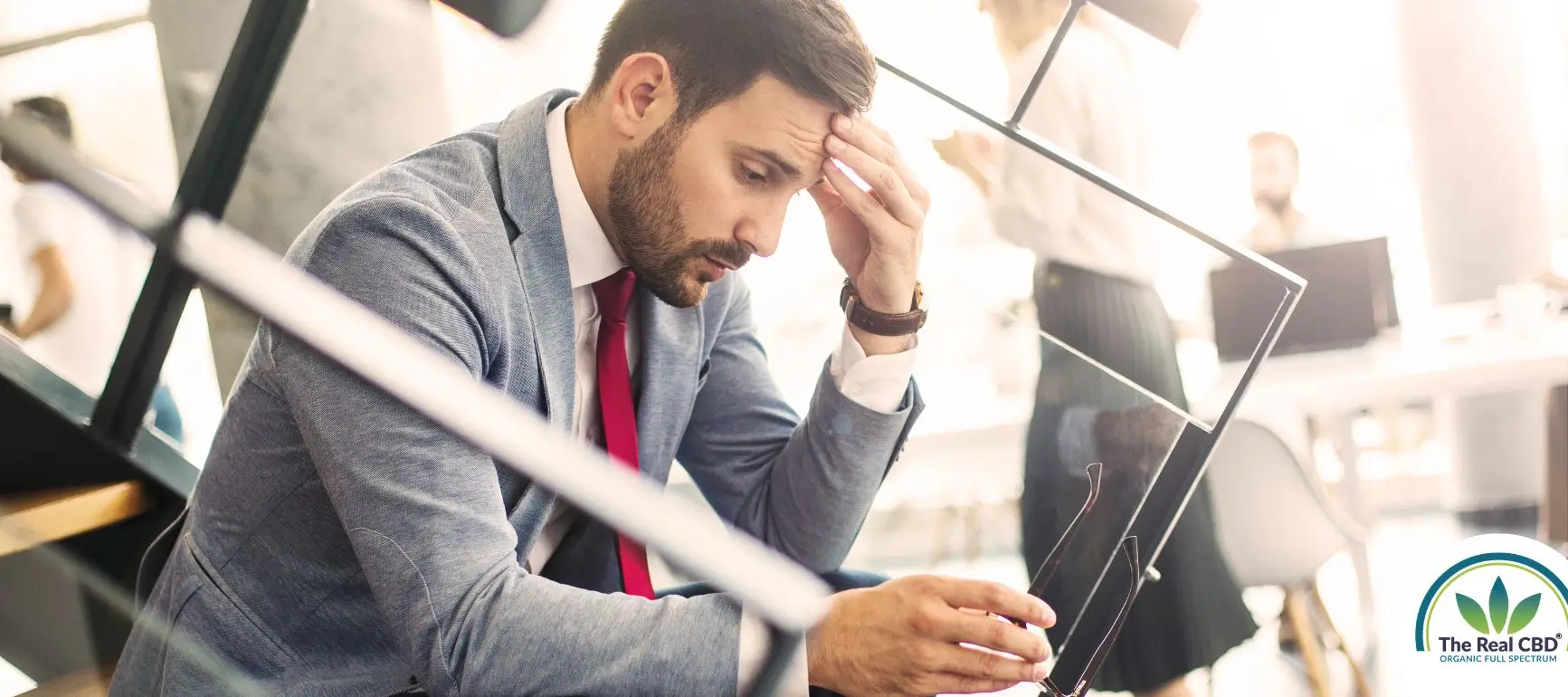 Man sitting on a starircase looking exhausted