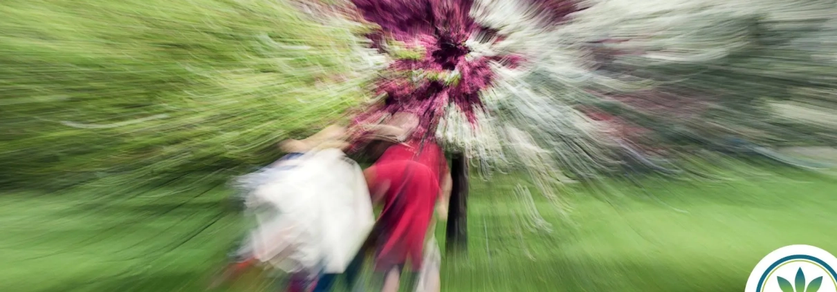 Blurry tunnel vision of two people walking in the forrest