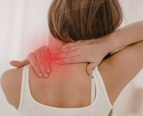 Woman holding her neck in pain