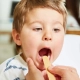 Boy being examined in his throath by his doctor